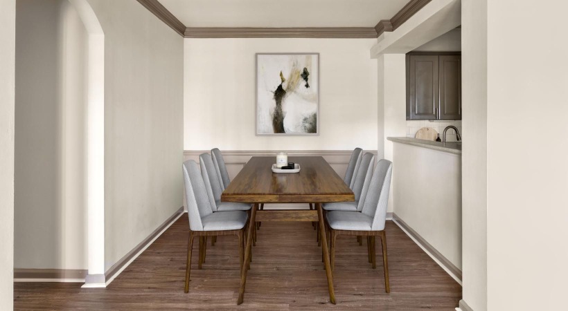 a dining room with a table and chairs
